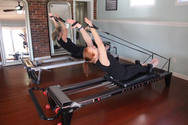 Pilates Students on Reformer